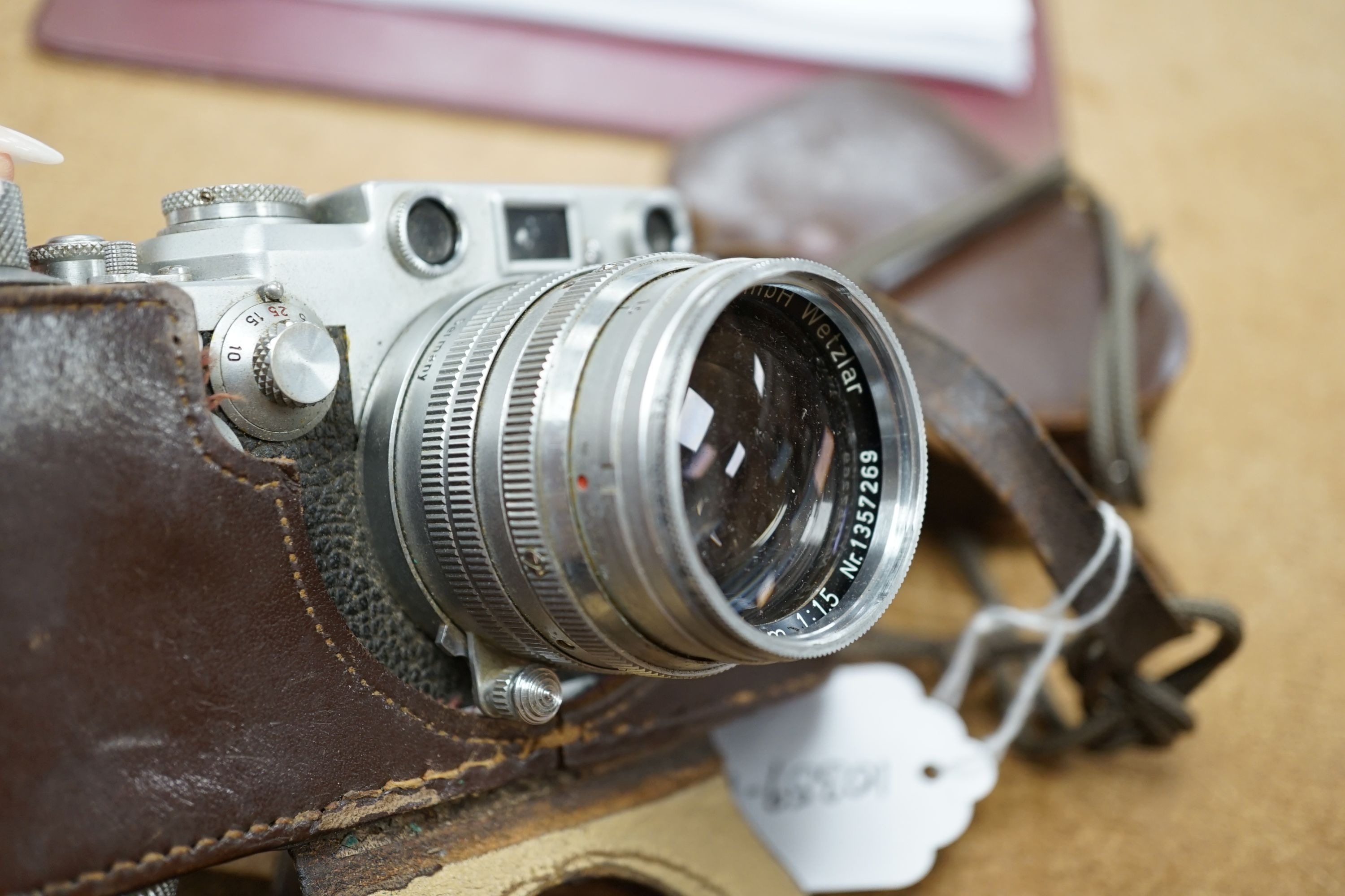 A cased Leica III camera serial number 767261 with Ernst Leitz GmbH Wetzlar Summarit f=5cm 1:15 No.135729 lens and light exposure meter
